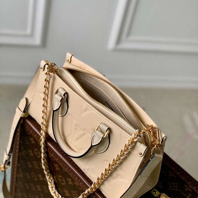 ONTHEGO EAST WEST BAG 25 IN BEIGE MONOGRAM EMBOSSED COWHIDE