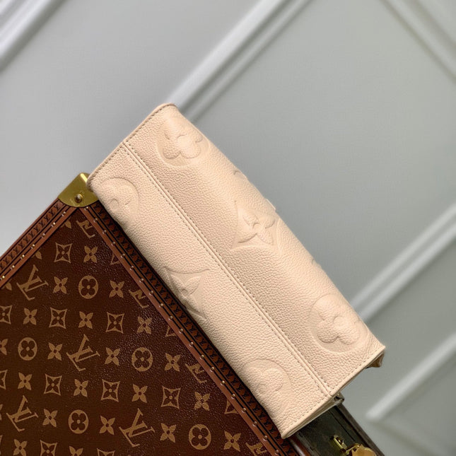 ONTHEGO EAST WEST BAG 25 IN BEIGE MONOGRAM EMBOSSED COWHIDE