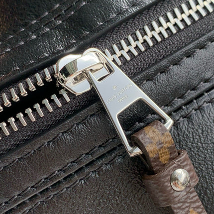 POCHETTE VIBE HANDBAG 25 IN BLACK LAMBSKIN BROWN COWHIDE AND COATED CANVAS TRIM