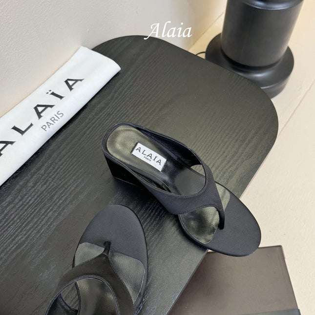 ALAIA WEDGE THONG SANDALS 25S IN BLACK SATIN