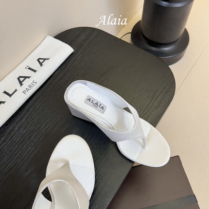 ALAIA WEDGE THONG SANDALS 25S IN WHITE SATIN