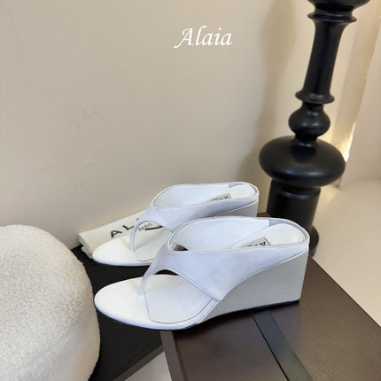 ALAIA WEDGE THONG SANDALS 25S IN WHITE SATIN