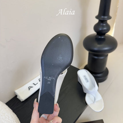 ALAIA WEDGE THONG SANDALS 25S IN WHITE SATIN