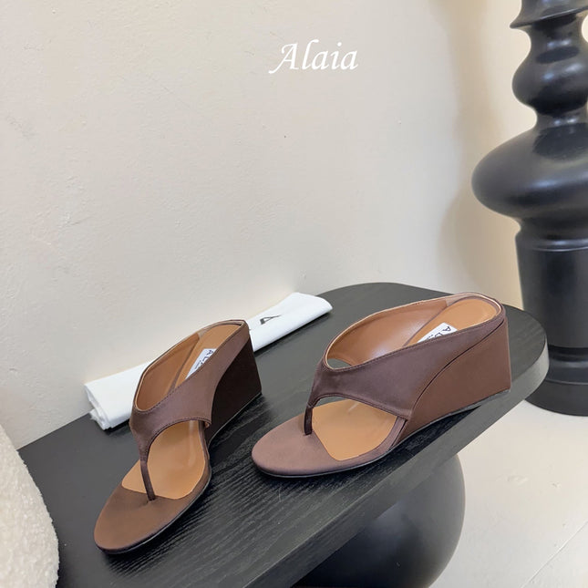 ALAIA WEDGE THONG SANDALS 25S IN BROWN SATIN
