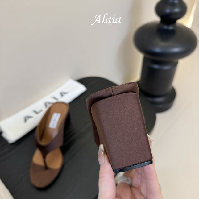 ALAIA WEDGE THONG SANDALS 25S IN BROWN SATIN
