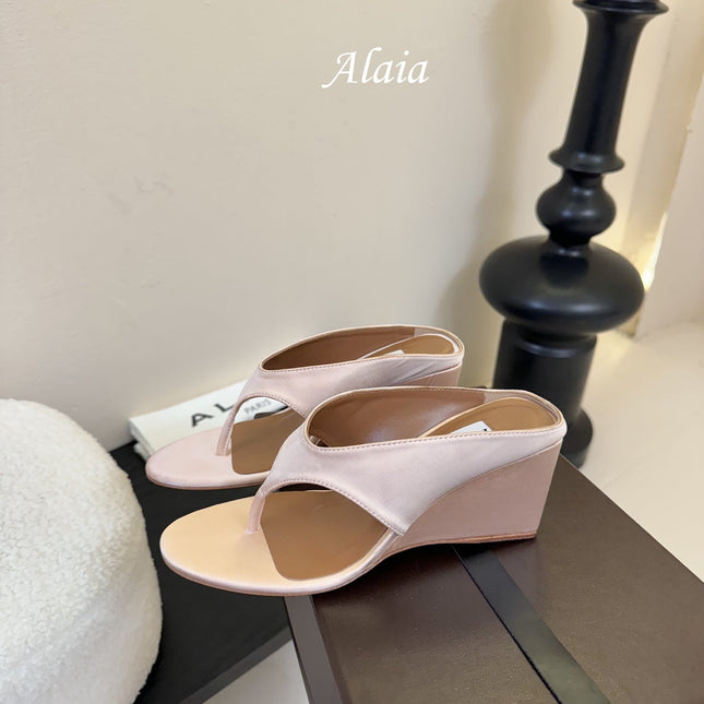 ALAIA WEDGE THONG SANDALS 25S IN BLUSH BEIGE SATIN