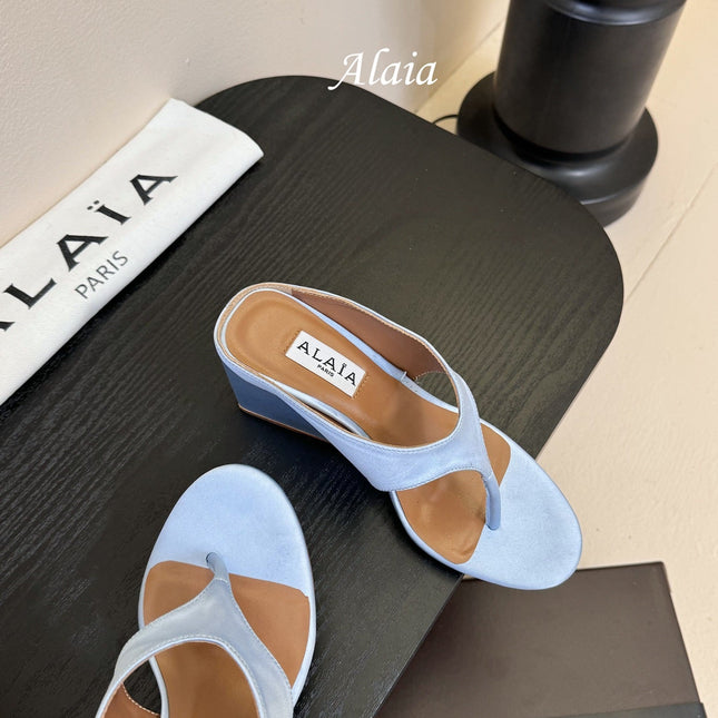 ALAIA WEDGE THONG SANDALS 25S IN BLUE SATIN
