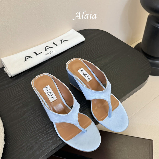 ALAIA WEDGE THONG SANDALS 25S IN BLUE SATIN