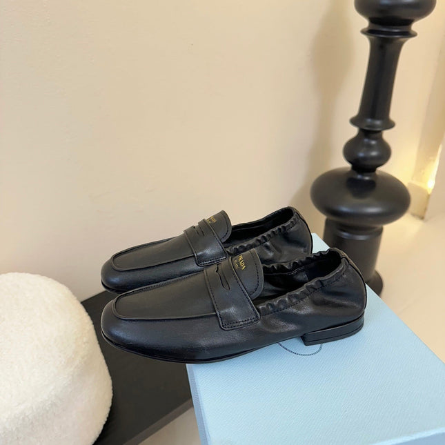 PRADA 25S SHUFFLE LOAFERS IN BLACK CALFSKIN
