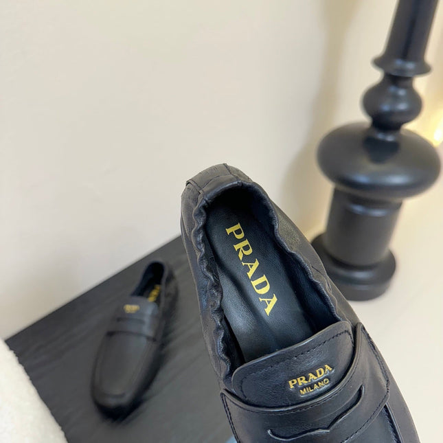 PRADA 25S SHUFFLE LOAFERS IN BLACK CALFSKIN