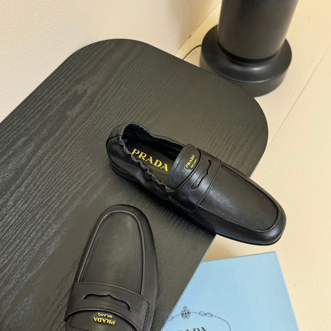 PRADA 25S SHUFFLE LOAFERS IN BLACK CALFSKIN