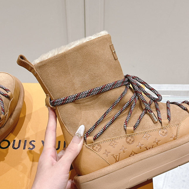 ASPEN PLATFORM ANKLE BOOT IN CIDER BROWN MONOGRAM DEBOSSED SUEDE AND SHEARLING