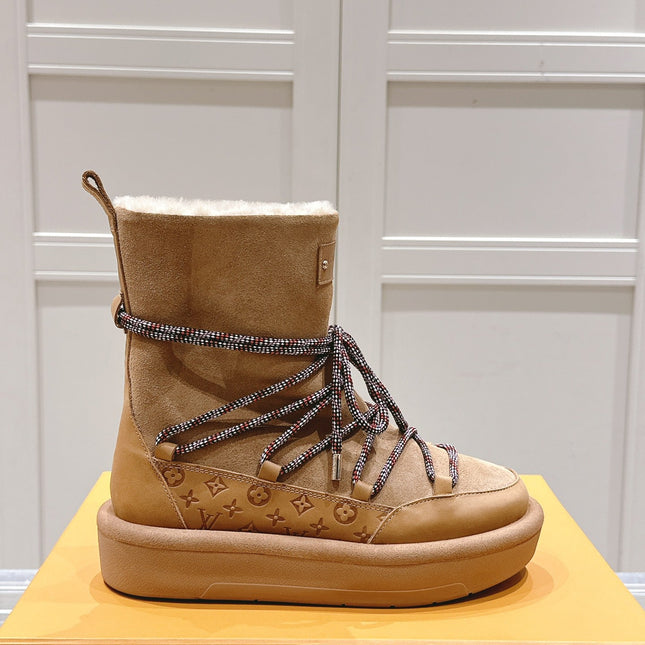 ASPEN PLATFORM ANKLE BOOT IN CIDER BROWN MONOGRAM DEBOSSED SUEDE AND SHEARLING