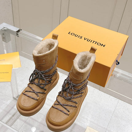 ASPEN PLATFORM ANKLE BOOT IN CIDER BROWN MONOGRAM DEBOSSED SUEDE AND SHEARLING