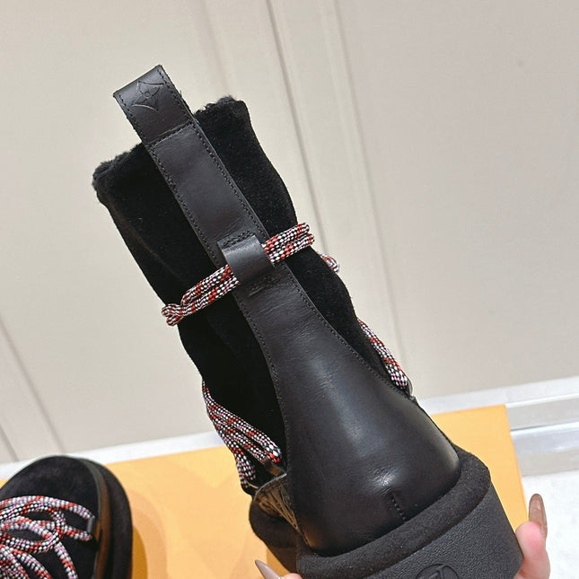 ASPEN PLATFORM ANKLE BOOT IN BLACK MONOGRAM DEBOSSED SUEDE AND SHEARLING