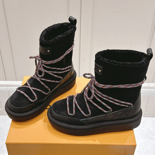 ASPEN PLATFORM ANKLE BOOT IN BLACK MONOGRAM DEBOSSED SUEDE AND SHEARLING