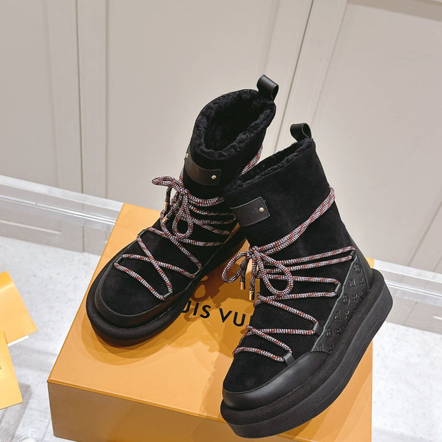 ASPEN PLATFORM ANKLE BOOT IN BLACK MONOGRAM DEBOSSED SUEDE AND SHEARLING