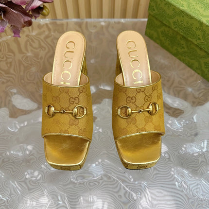 HORSEBIT SLIDE SANDAL IN GOLD MONOGRAM CANVAS AND SHEEPSKIN LINING