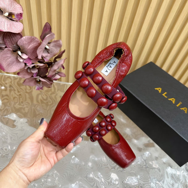 ALAIA MARY JANE PEARL IN GLOSSY MARS RED LAMBSKIN