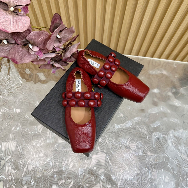 ALAIA MARY JANE PEARL IN GLOSSY MARS RED LAMBSKIN