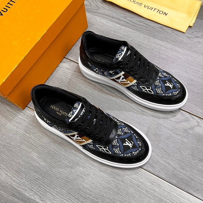 LV TRAINER IN BLACK EMBOSSED CALFSKIN AND MONOGRAM FABRIC