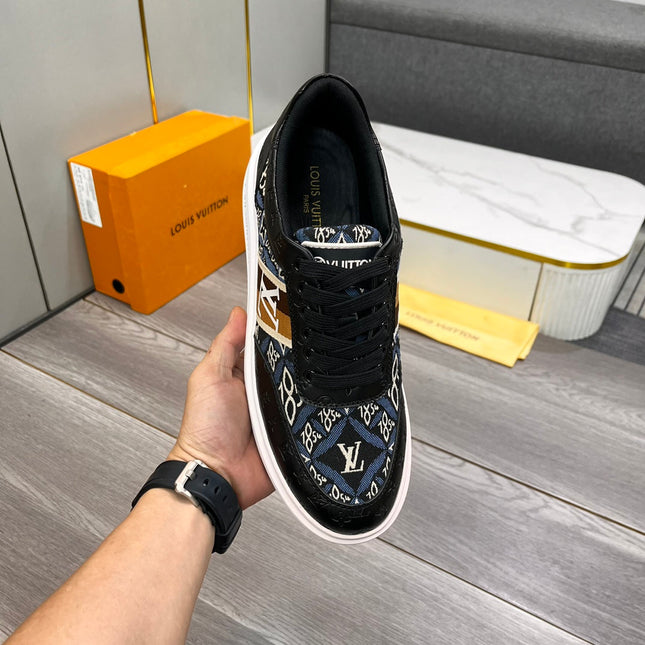 LV TRAINER IN BLACK EMBOSSED CALFSKIN AND MONOGRAM FABRIC
