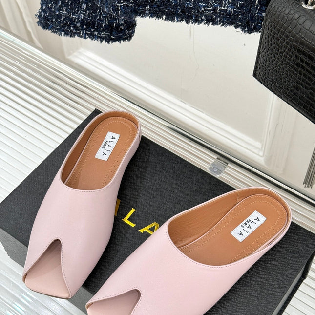 ALAIA FLAT MULE IN LIGHT PINK LAMBSKIN