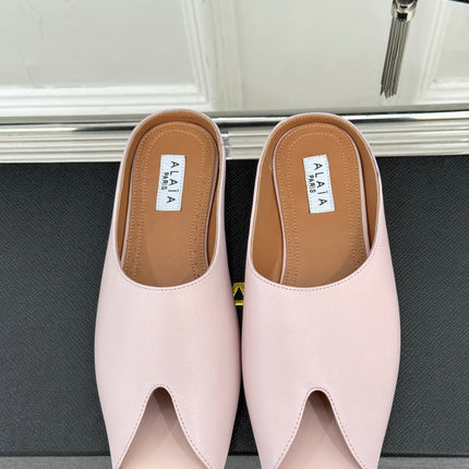 ALAIA FLAT MULE IN LIGHT PINK LAMBSKIN