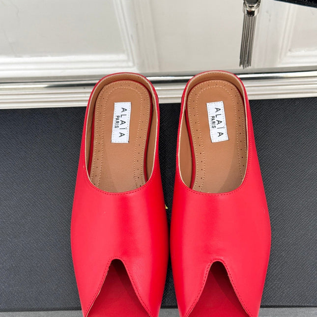 ALAIA FLAT MULE IN CRIMSON RED LAMBSKIN