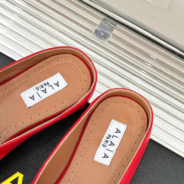 ALAIA FLAT MULE IN CRIMSON RED LAMBSKIN