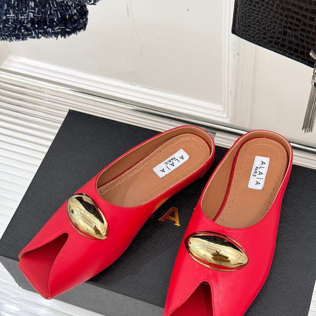 ALAIA FLAT MULE IN CRIMSON RED LAMBSKIN WITH GOLD HARDWARE