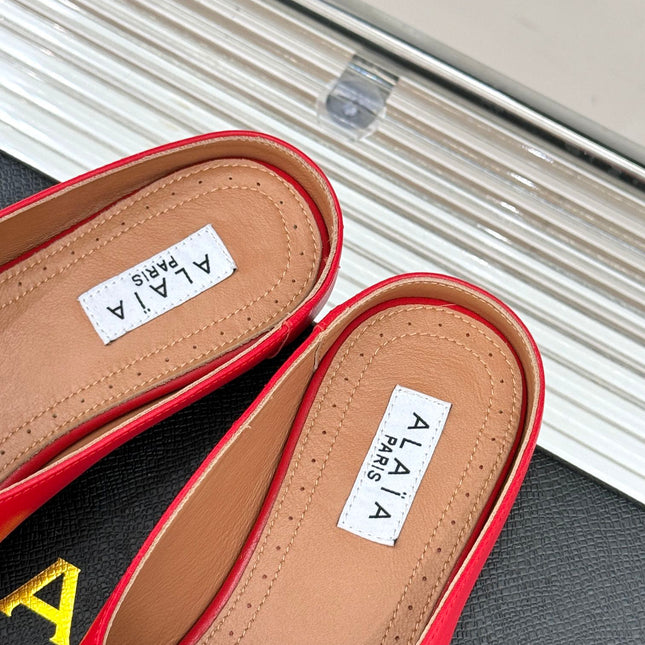 ALAIA FLAT MULE IN CRIMSON RED LAMBSKIN WITH GOLD HARDWARE