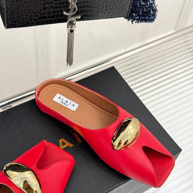 ALAIA FLAT MULE IN CRIMSON RED LAMBSKIN WITH GOLD HARDWARE