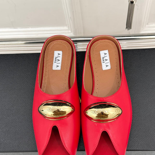 ALAIA FLAT MULE IN CRIMSON RED LAMBSKIN WITH GOLD HARDWARE