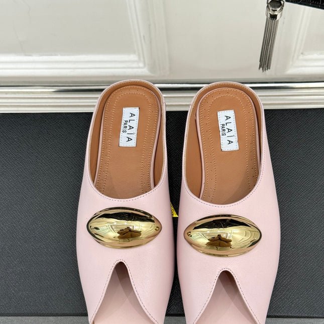 ALAIA FLAT MULE IN LIGHT PINK LAMBSKIN WITH GOLD HARDWARE