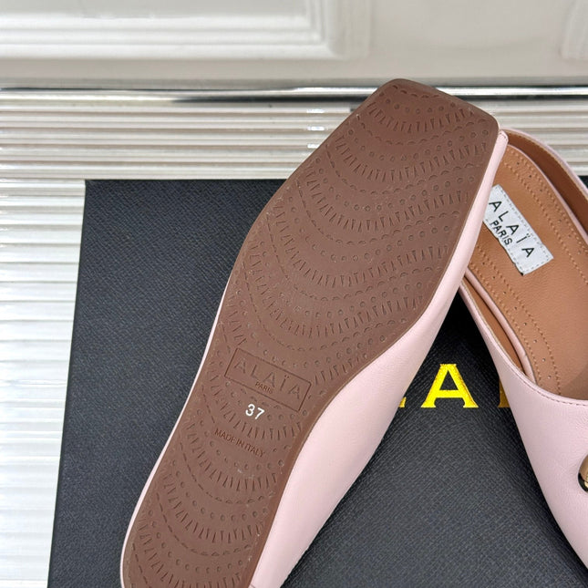 ALAIA FLAT MULE IN LIGHT PINK LAMBSKIN WITH GOLD HARDWARE