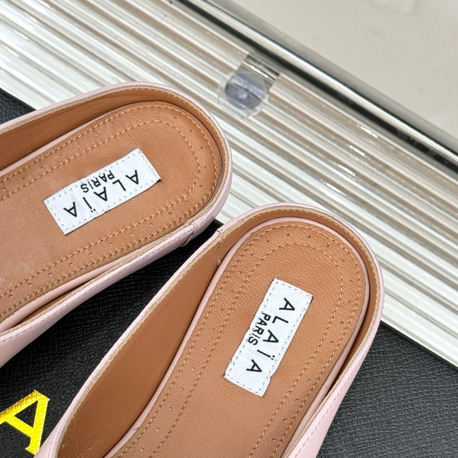 ALAIA FLAT MULE IN LIGHT PINK LAMBSKIN WITH GOLD HARDWARE