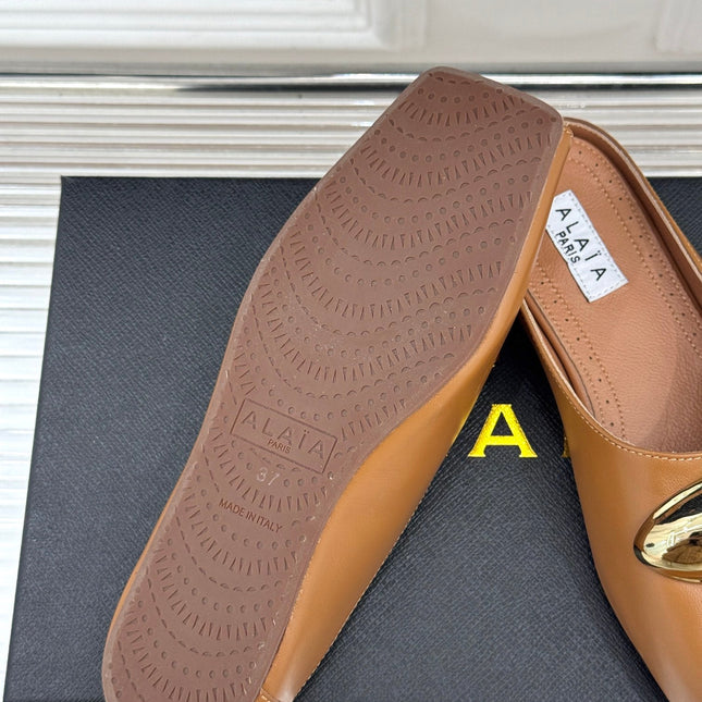ALAIA FLAT MULE IN BRONZE BROWN LAMBSKIN WITH GOLD HARDWARE