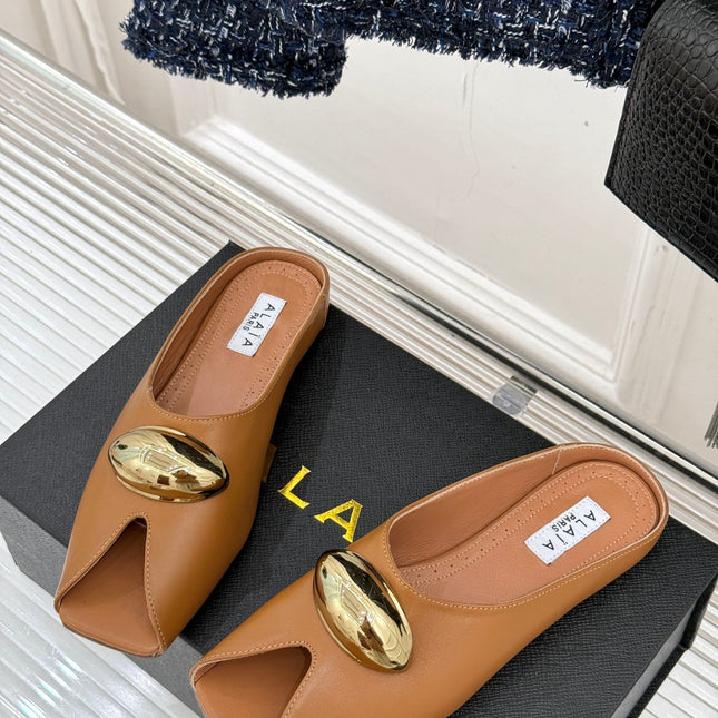 ALAIA FLAT MULE IN BRONZE BROWN LAMBSKIN WITH GOLD HARDWARE