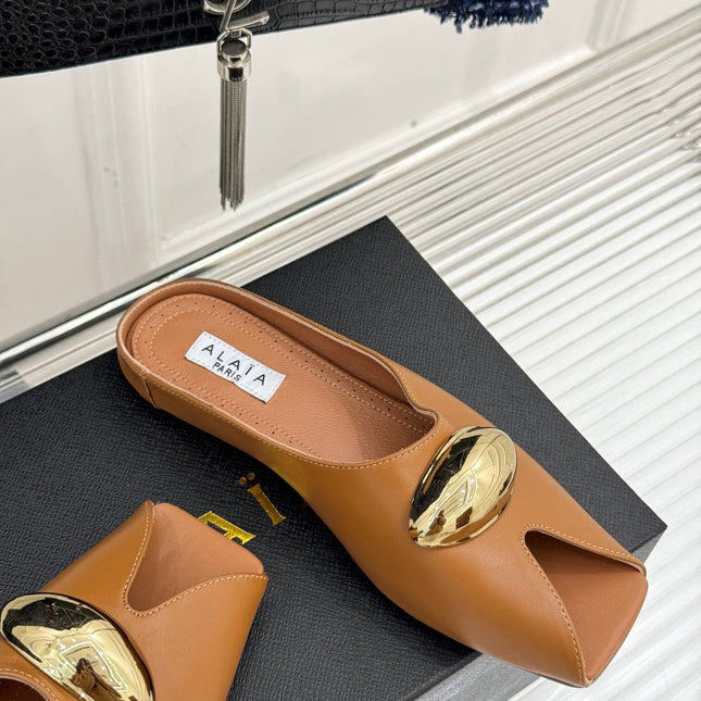 ALAIA FLAT MULE IN BRONZE BROWN LAMBSKIN WITH GOLD HARDWARE