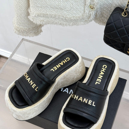 PLATFORM SLIPPERS IN BLACK LAMBSKIN