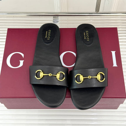 SLIDE SANDALS IN BLACK CALFSKIN WITH GOLD HARDWARE