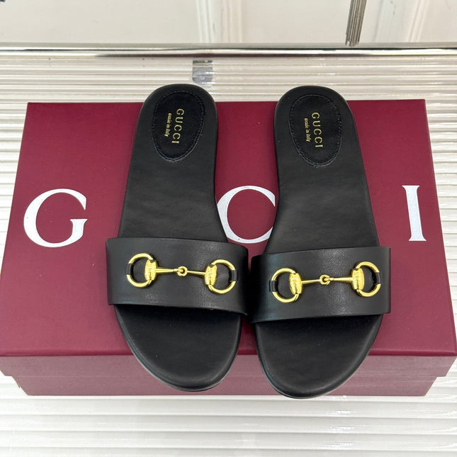 SLIDE SANDALS IN BLACK CALFSKIN WITH GOLD HARDWARE