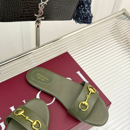 SLIDE SANDALS IN MOSS GREEN CALFSKIN WITH GOLD HARDWARE