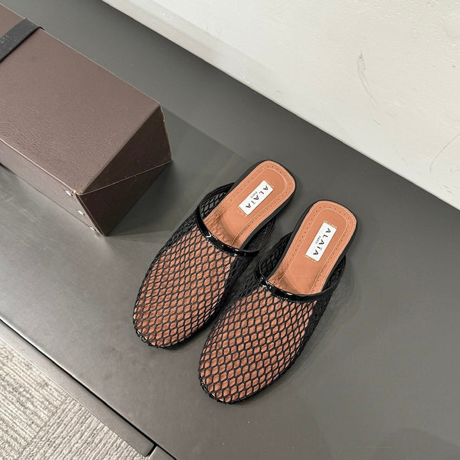 ALAIA FLAT MULES IN BLACK MESH FISHNET
