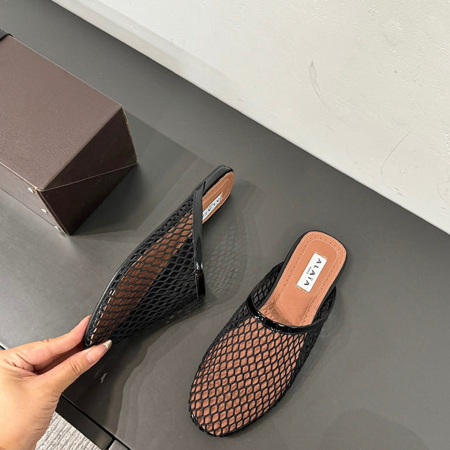 ALAIA FLAT MULES IN BLACK MESH FISHNET