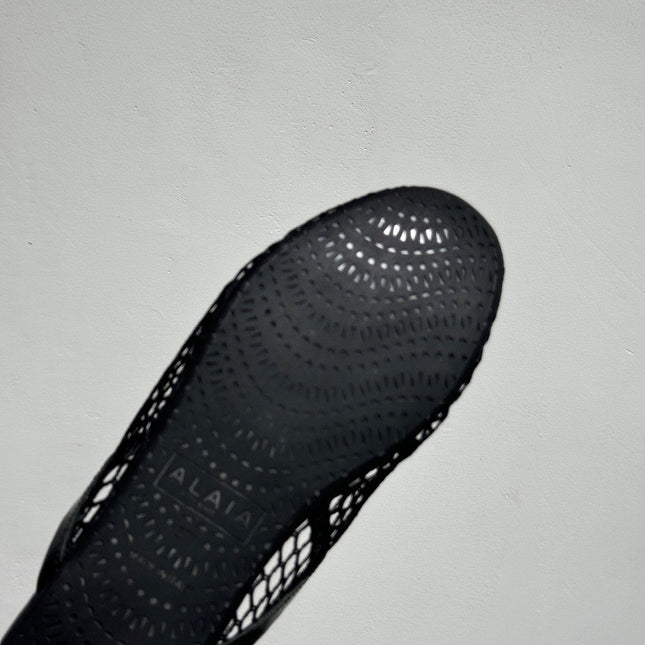 ALAIA FLAT MULES IN BLACK MESH FISHNET