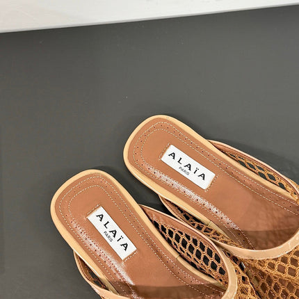 ALAIA FLAT MULES IN COPPER BROWN MESH FISHNET