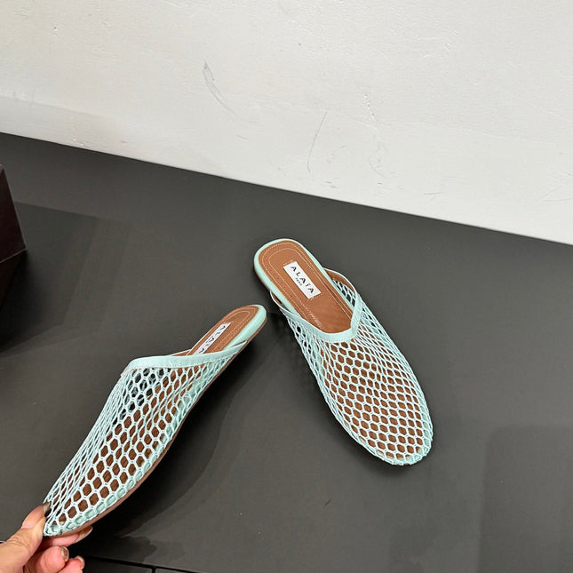 ALAIA FLAT MULES IN LIGHT BLUE MESH FISHNET