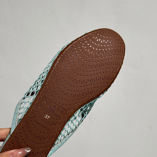 ALAIA FLAT MULES IN LIGHT BLUE MESH FISHNET